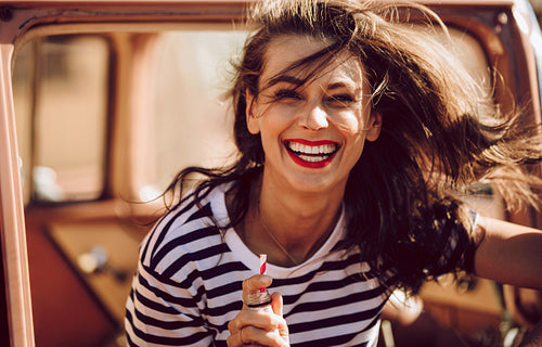 Woman enjoying on a road trip