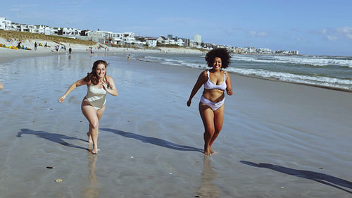 Women in their bikini bodies having a great time outdoors