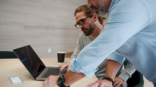 Problem solving in computer programming: Software engineers creating tech solutions in an office