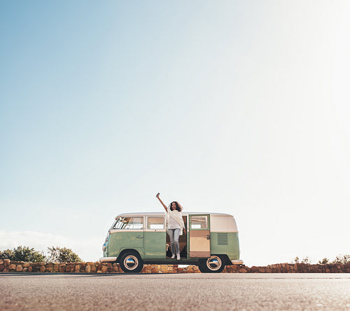 African woman having fun on road trip