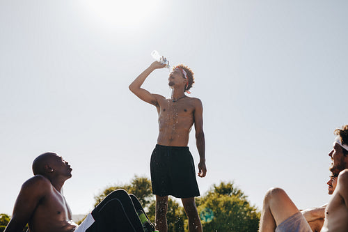 Men relaxing during a football game