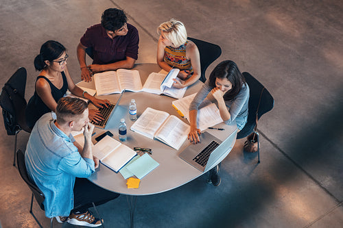 Mixed race students studying together