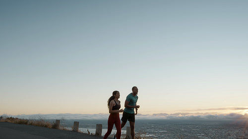 Couple jogging on a mountain road