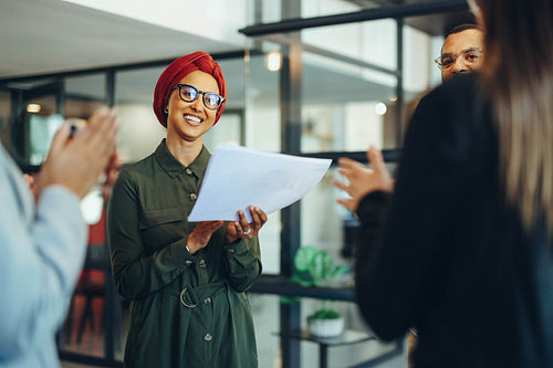 Happy businesspeople applauding during a meeting