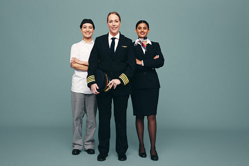 Friendly women from different service occupations standing in a