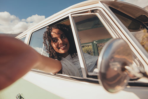 African woman road trip driving a van