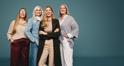Happy strong women smiling confidently in a studio