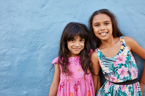 Adorable little girls posing together with cute smile