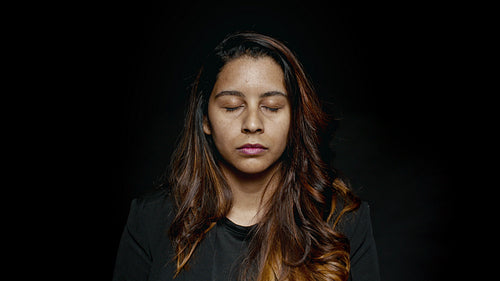 Businesswoman with eyes closed