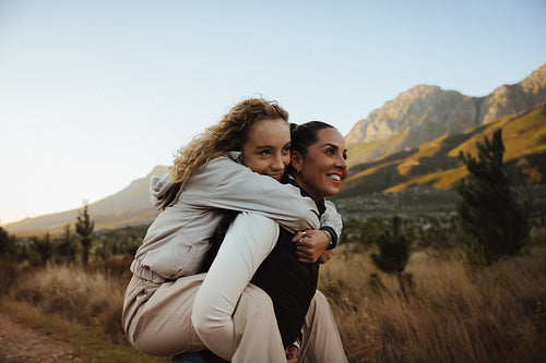 Friends bonding outdoors in scenic landscape