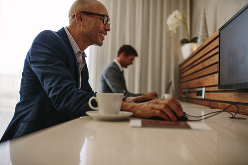 Business people at internet cafe in an airport terminal