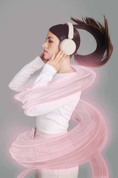 Young woman listening to music and getting immersed into the song