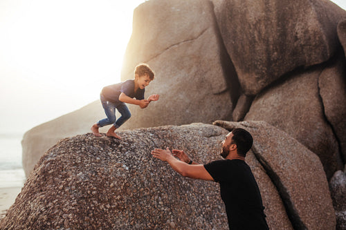 Father and son having fun on summer holidays 