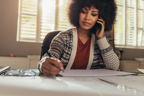 Architect talking with client while preparing new plan