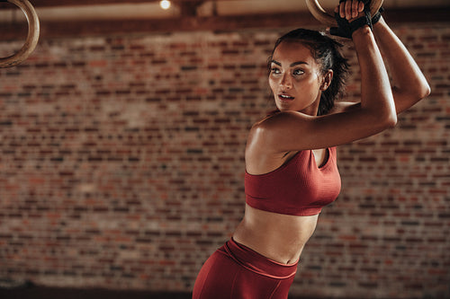 Sportswoman taking rest after intense dip ring