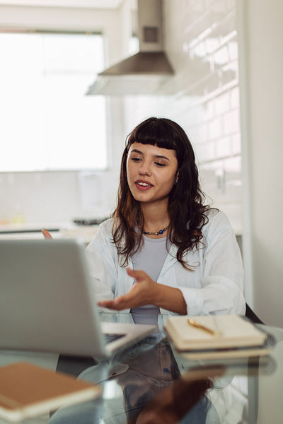 Smiling businesswoman attending a virtual meeting