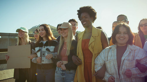 Youthful crowd standing united for change