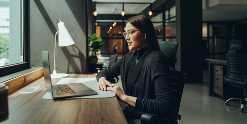 Businesswoman having an online meeting in a coworking office
