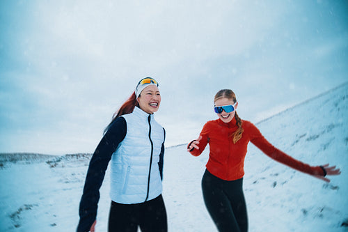 Running women share friendship and endurance in a winter workout