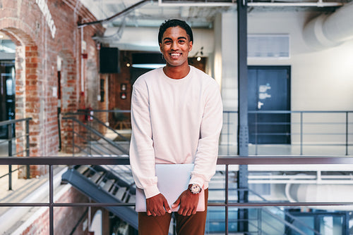 Modern businessman smiling at the camera