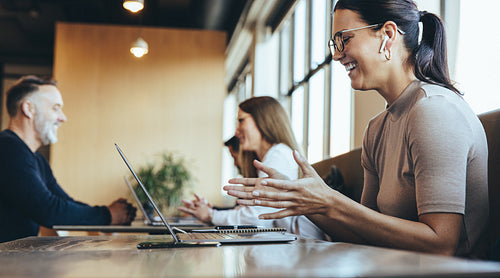 Female entrepreneur having a virtual meeting in a co-working spa