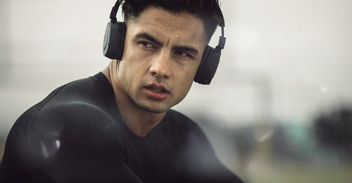 Athlete listening music during workout break