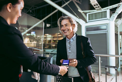 Man showing electronic flight ticket