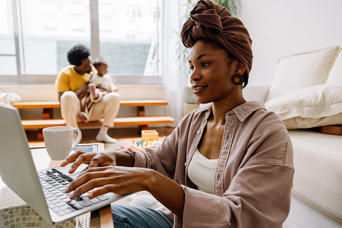 Woman working on laptop at home