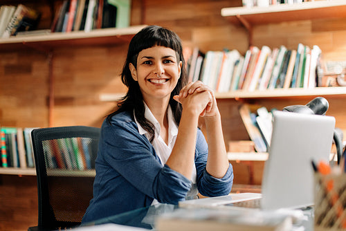 Happy businesswoman smiling at the camera