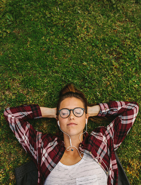 Female relaxing and listening to music