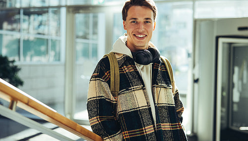 Young man standing at college