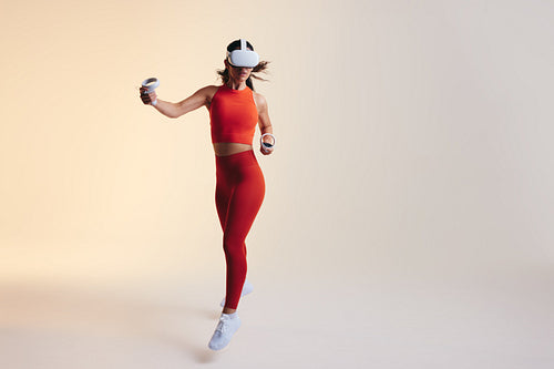 Young woman working out in virtual reality