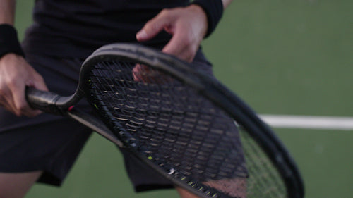 Tennis player ready to return with his racket