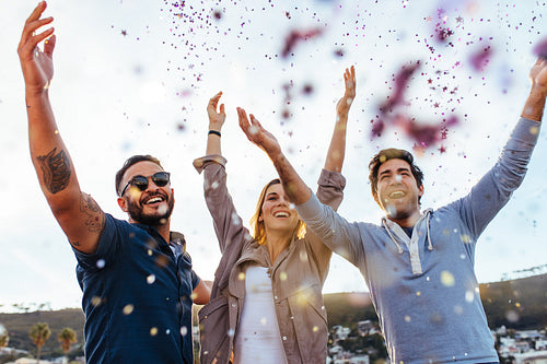Millennial enjoying at party with confetti