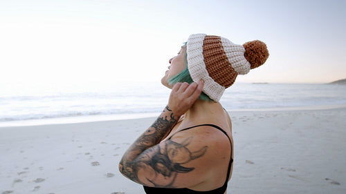 Excited female going for a swim in the sea