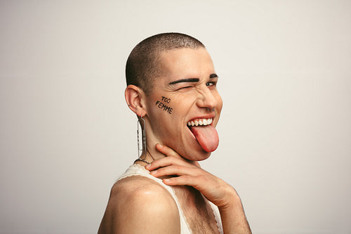 Gender fluid man making funny faces