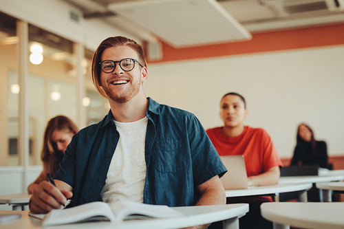 Young male student in high school classroom