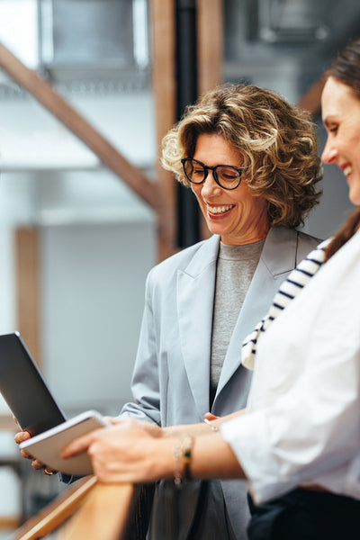 Female entrepreneurs doing a video call in an office