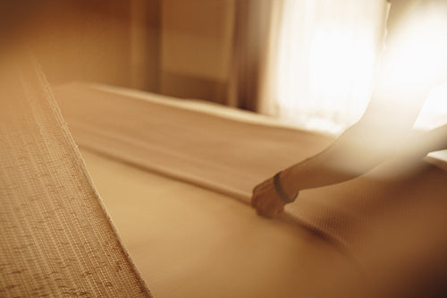 Serene bedroom in a luxury resort with warm lighting and soft textures
