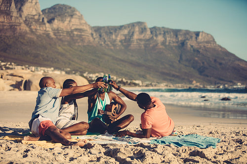 Group of friends partying on beach vacation