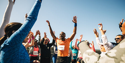 Friends celebrating after a successful group running race event