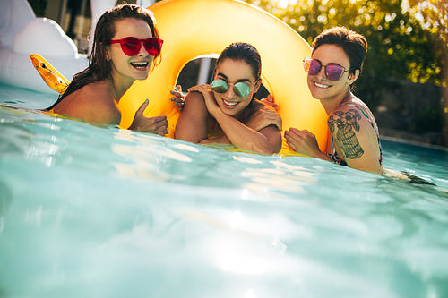 Female friends having fun in a swimming pool