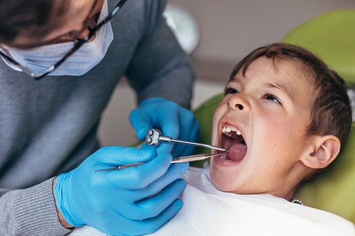 Little boy getting dental treatment