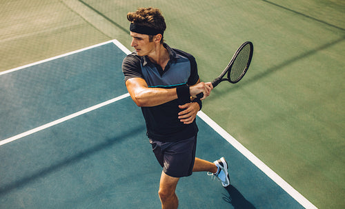 Tennis player practicing forehands