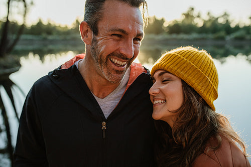 Loving couple standing by a lake