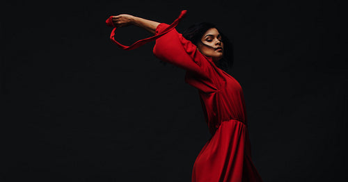 Beautiful woman dancing in studio