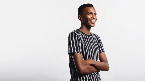 Smiling african man with arms crossed