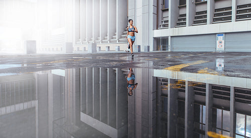Woman running outdoors on a foggy day