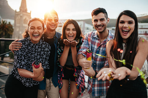 Best friends enjoying the party together with confetti