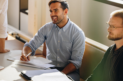 Young man at startup meeting